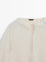 Shirt with ruffled sleeves