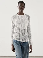 Semi-sheer lace blouse