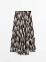 Long flared skirt with checked detail