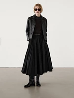 Pleated skirt with leather detail