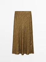 Creased-effect pleated skirt