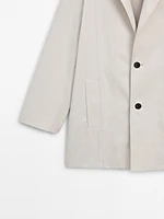 Oversize blazer with contrast buttons