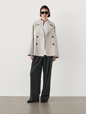 Short trench coat with back pleat