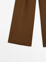 Linen trousers with darts at the waist