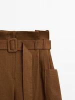 Linen trousers with darts at the waist