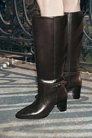 BUCKLED KNEE HIGH HEELED LEATHER BOOTS