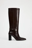 BUCKLED KNEE HIGH HEELED LEATHER BOOTS