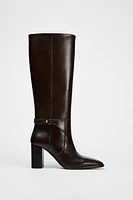 BUCKLED KNEE HIGH HEELED LEATHER BOOTS