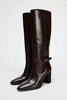 BUCKLED KNEE HIGH HEELED LEATHER BOOTS