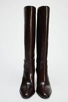 BUCKLED KNEE HIGH HEELED LEATHER BOOTS