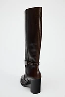 BUCKLED KNEE HIGH HEELED LEATHER BOOTS