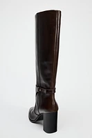 BUCKLED KNEE HIGH HEELED LEATHER BOOTS