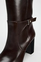 BUCKLED KNEE HIGH HEELED LEATHER BOOTS