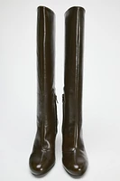 Knee high boots made of leather. Wide shaft. Rounded toe. Zip closure. <br/><br/>Heel height: 3.3 inches (8.5 cm)