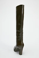 Knee high boots made of leather. Wide shaft. Rounded toe. Zip closure. <br/><br/>Heel height: 3.3 inches (8.5 cm)