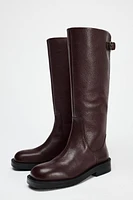 BUCKLED LEATHER FLAT BOOTS