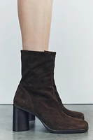 Suede boots. Block heels. Zip closure. Rounded toe. <br/><br/>Heel height: 3.1 inches (8 cm)