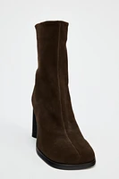 Suede boots. Block heels. Zip closure. Rounded toe. <br/><br/>Heel height: 3.1 inches (8 cm)