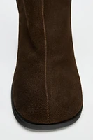 Suede boots. Block heels. Zip closure. Rounded toe. <br/><br/>Heel height: 3.1 inches (8 cm)