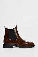 FLAT WINGTIP ANKLE BOOTS