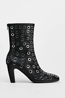 METAL GROMMET HEELED ANKLE BOOTS