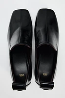 HEELED LEATHER LOAFERS