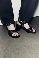 BUCKLED LEATHER SANDALS