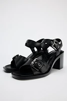 BUCKLED LEATHER SANDALS