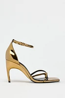 OVAL HEELED METALLIC SANDALS