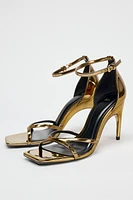 OVAL HEELED METALLIC SANDALS