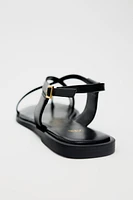 FLAT STRAPPY SANDALS WITH METAL EMBELLISHMENT