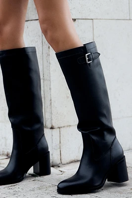 BUCKLED KNEE HIGH HEELED BOOTS