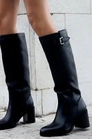 BUCKLED KNEE HIGH HEELED BOOTS