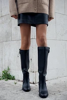 BUCKLED KNEE HIGH HEELED BOOTS