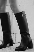 BUCKLED KNEE HIGH HEELED BOOTS