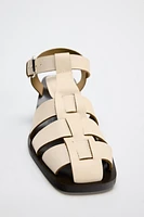 LEATHER CAGE SANDALS