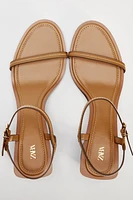 STITCHED HEELED LEATHER SANDALS