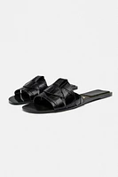 FLAT CROSSED LEATHER SANDALS