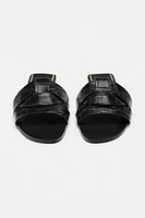 FLAT CROSSED LEATHER SANDALS