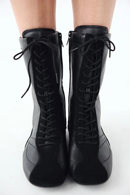 LACE-UP FLAT LEATHER ANKLE BOOTS