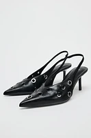 SLING BACK HEELS WITH GROMMETS