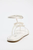 FLAT STRAPPY SANDALS WITH BOW