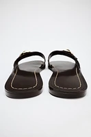 STUDDED FLAT SUEDE SANDALS