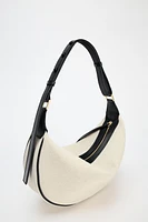 OVAL CROSSBODY BAG