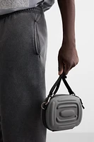 RIGID RUBBERIZED CROSSBODY BAG