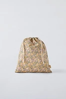 Bag with floral print. Adjustable lace-up closure.<br/><br/>Height x Length x Width: 13 x 11.4 x 0.8 inches (33 x 29 x 2 cm)