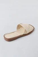 FLAT CROSSED-STRAP SANDALS