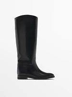 Riding-style boots with detachable embellishment