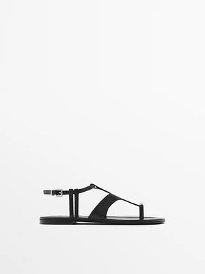 Flat sandals with metallic embellishment