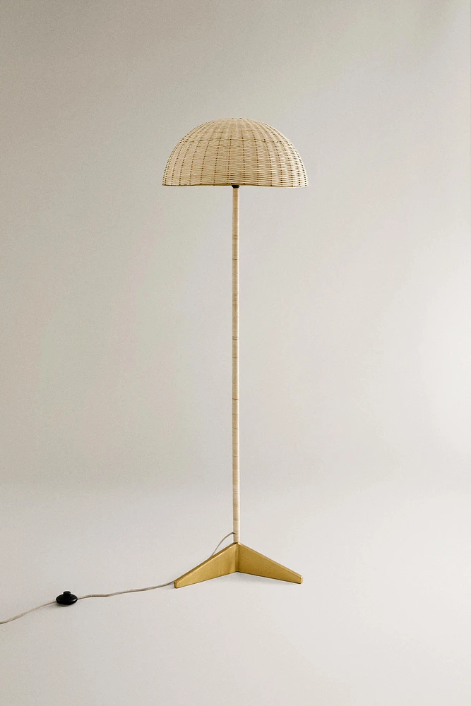 NANUSHKA RATTAN AND BRASS FLOOR LAMP